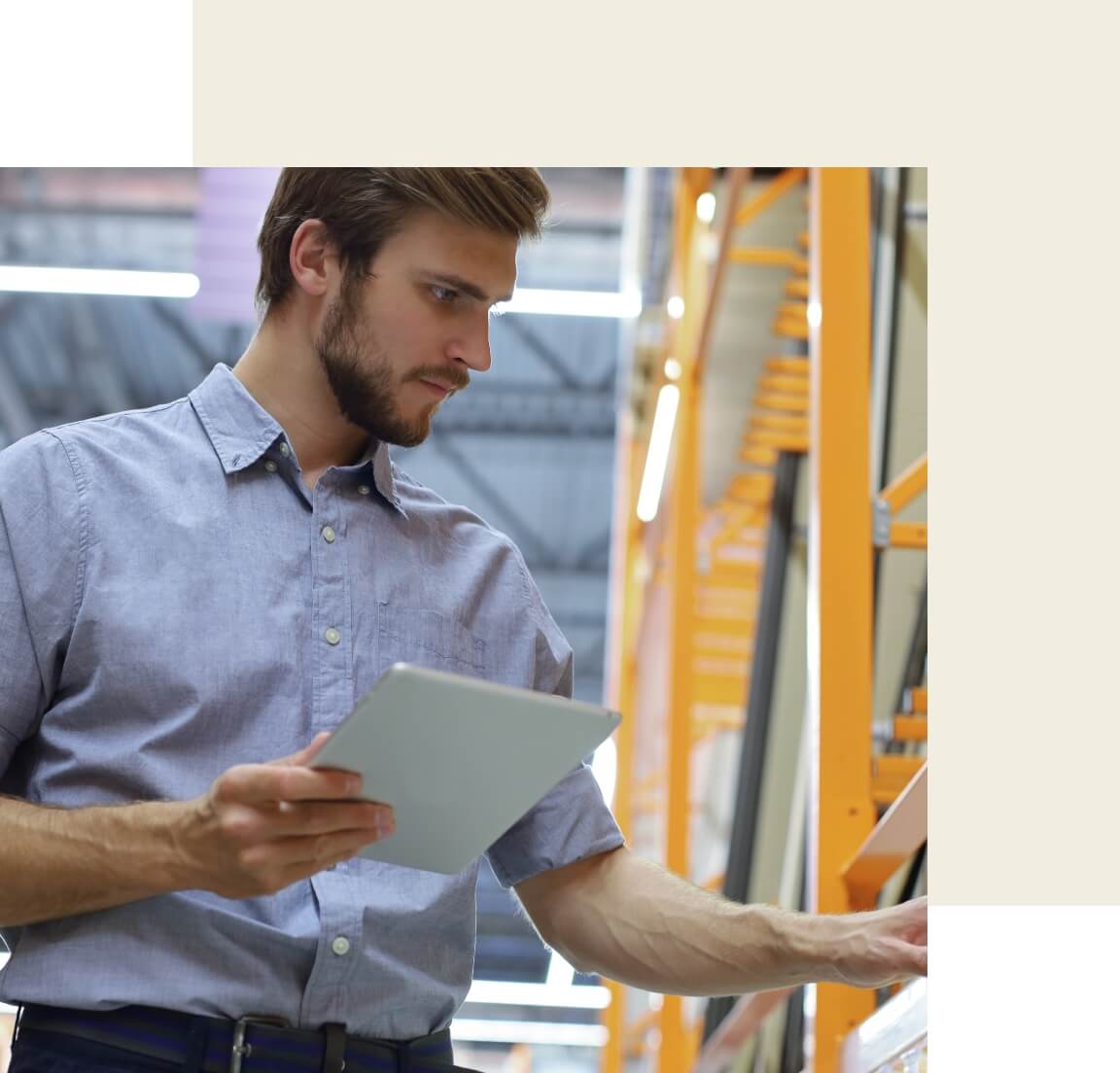 A warehouse worker checking some boxes